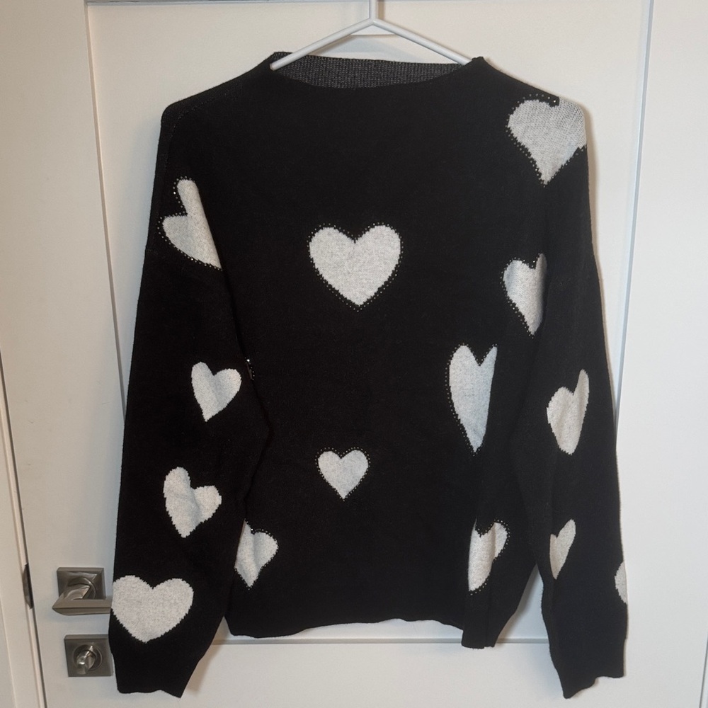 Chic Black Sweater with White Heart Design